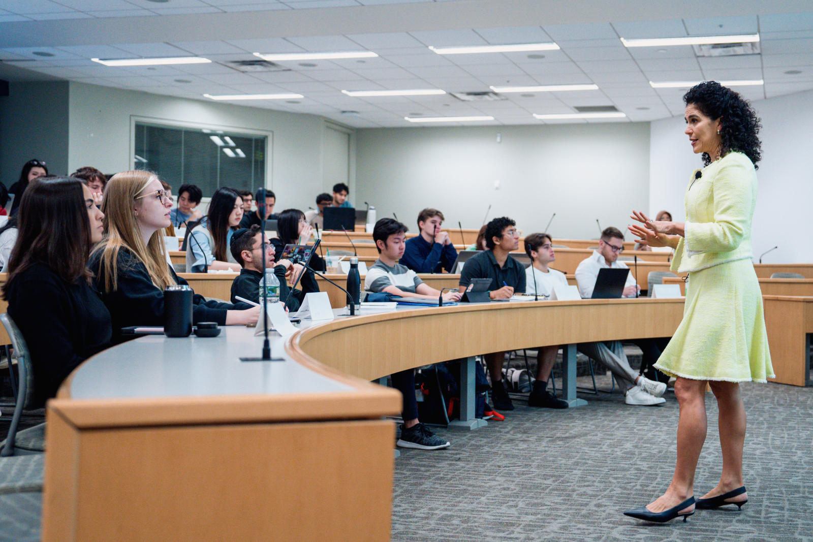 a lecturer talks to a group of students in a seminar