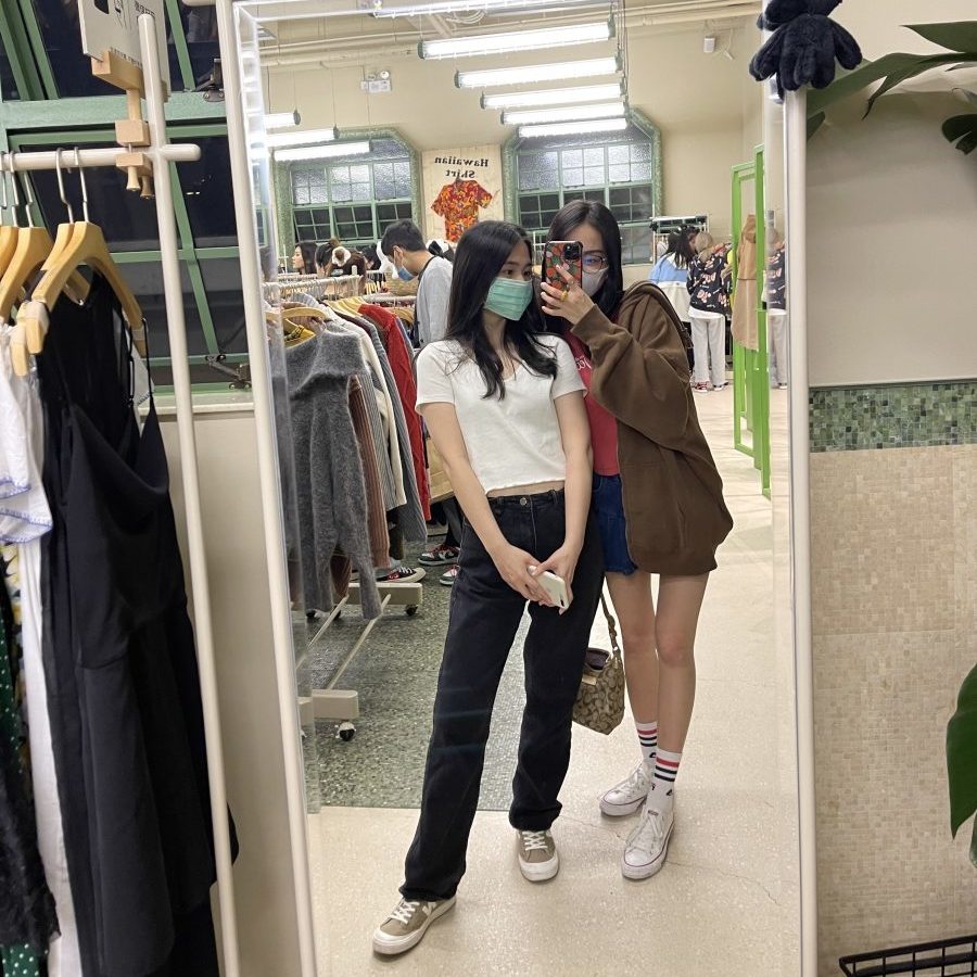 The author and her friend at a thrift store in Shanghai.
