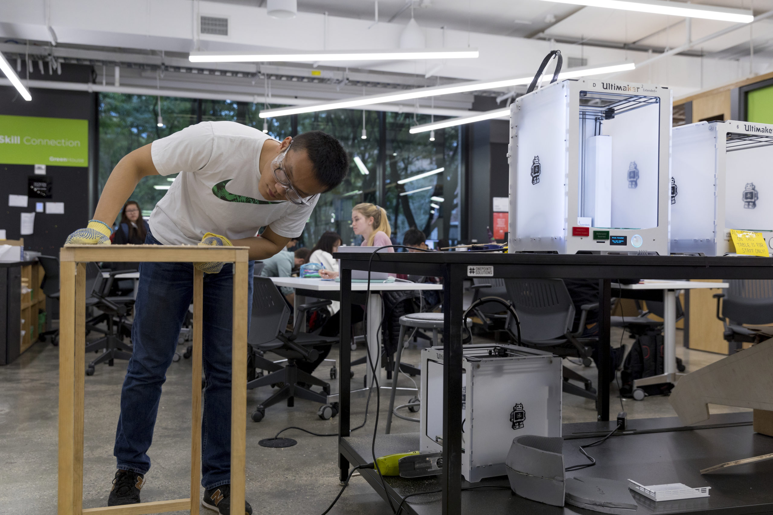 A student working on a project in the NYU Tandon MakerSpace.