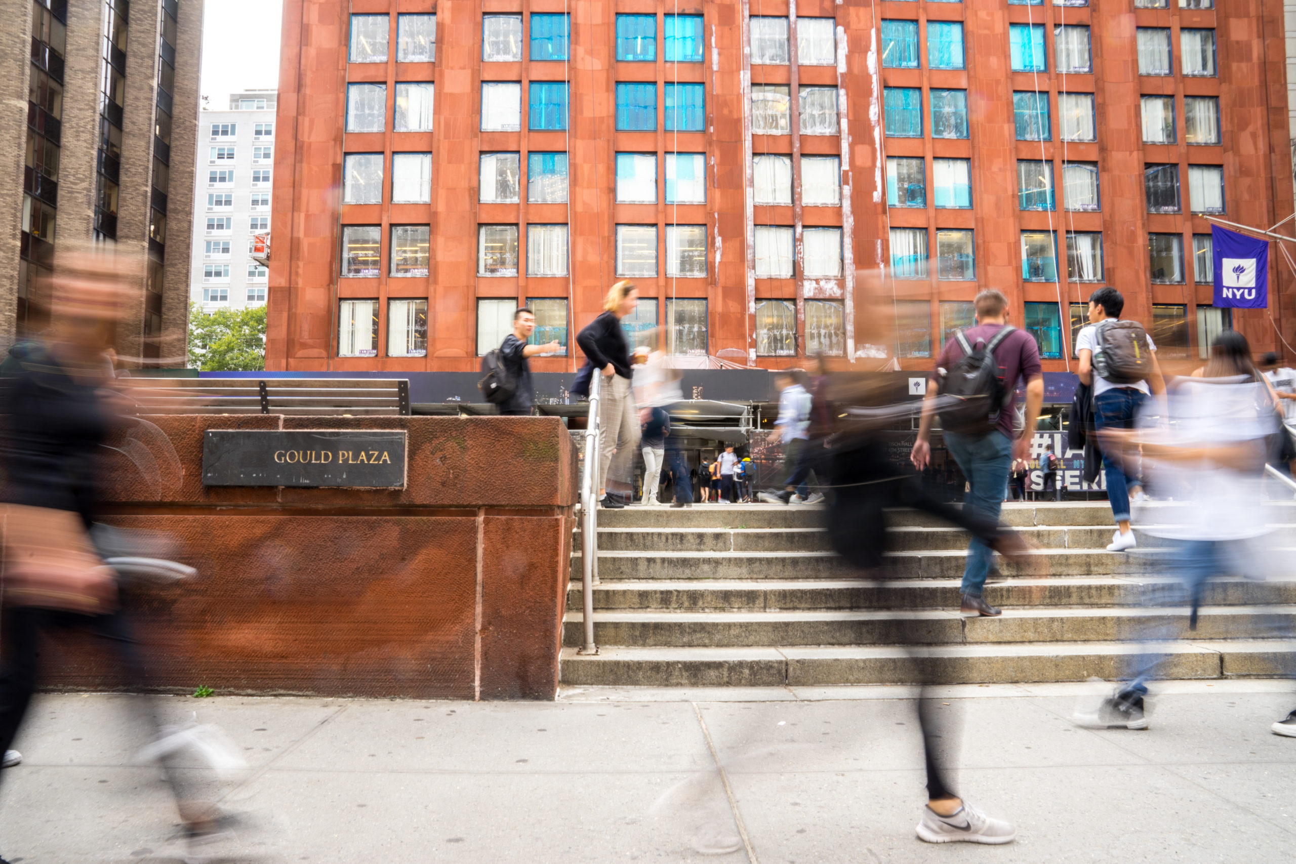 A time lapse of students passing by on the street outside NYU Stern.