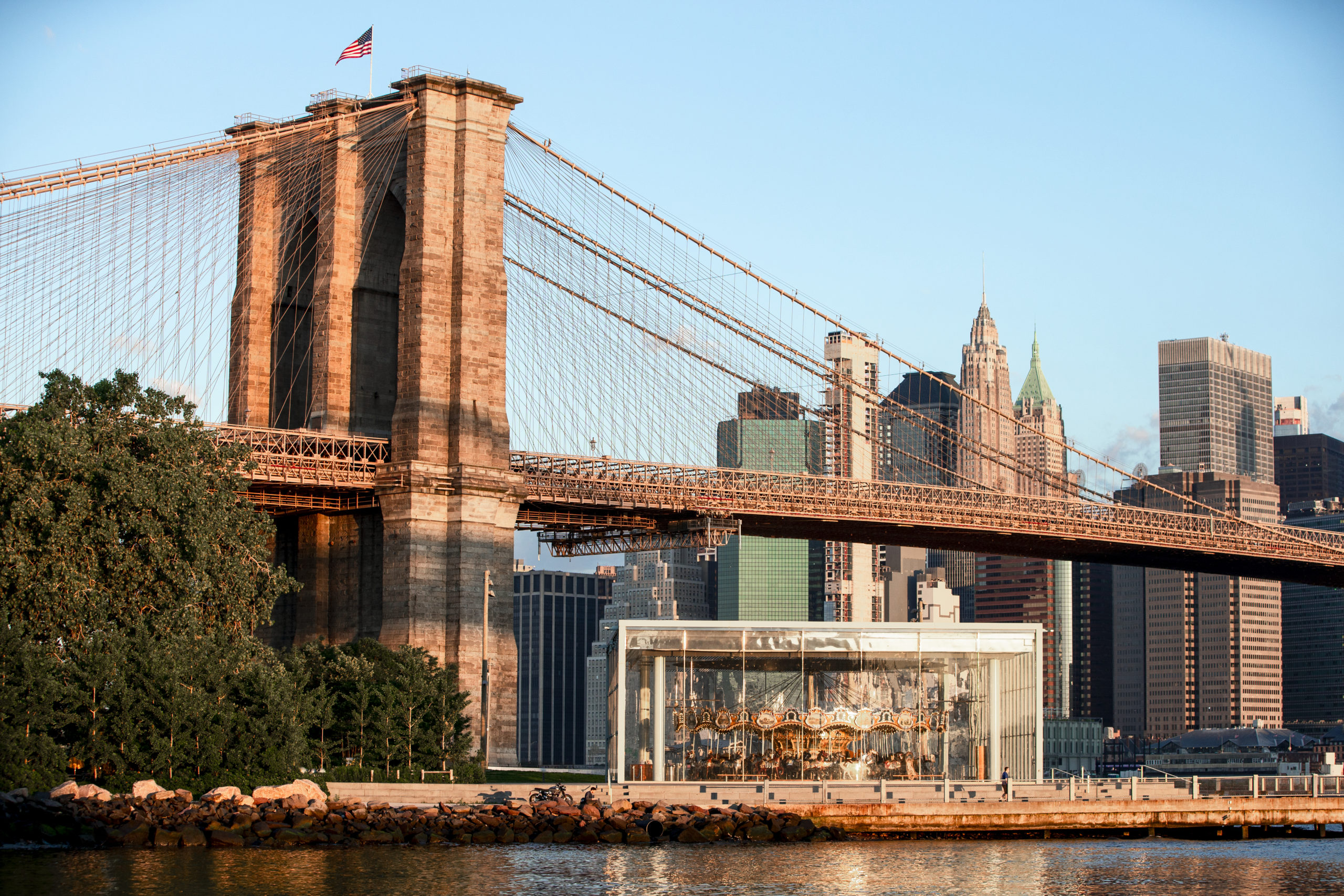 The Brooklyn Bridge with the Manhattan skyline behind it.