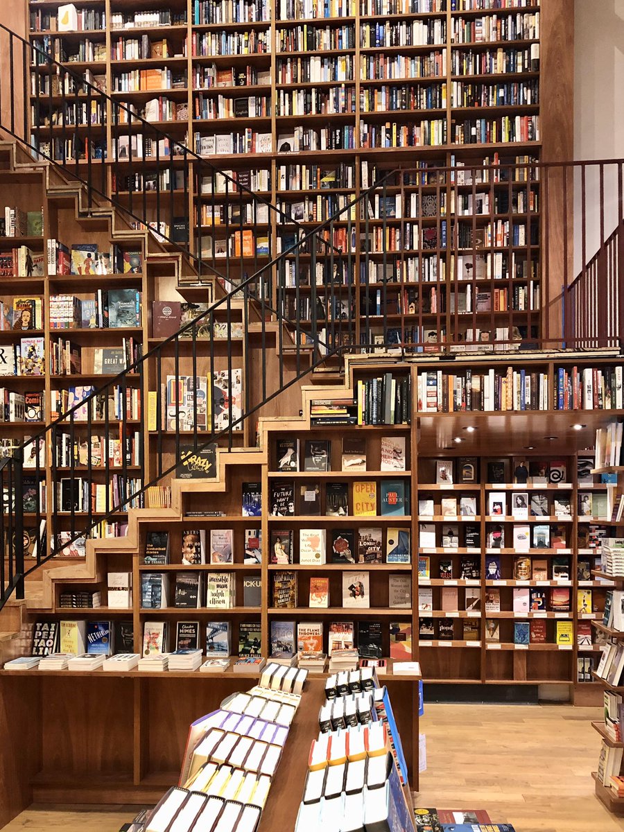 Floor to ceiling bookshelves stashed with books at McNally Jackson in Brooklyn.