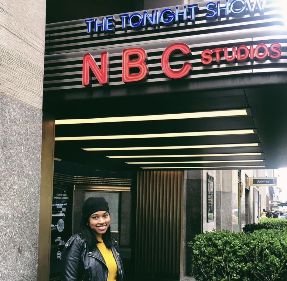 Student standing outside of the NBC building