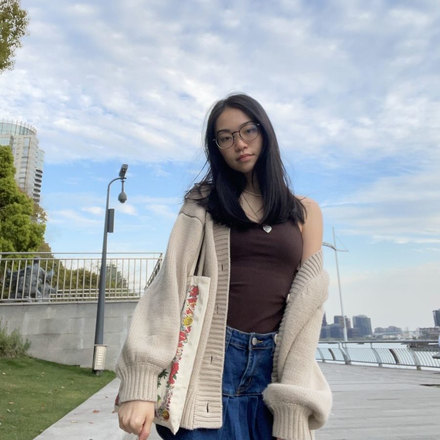 A student out in Shanghai on a sunny day.