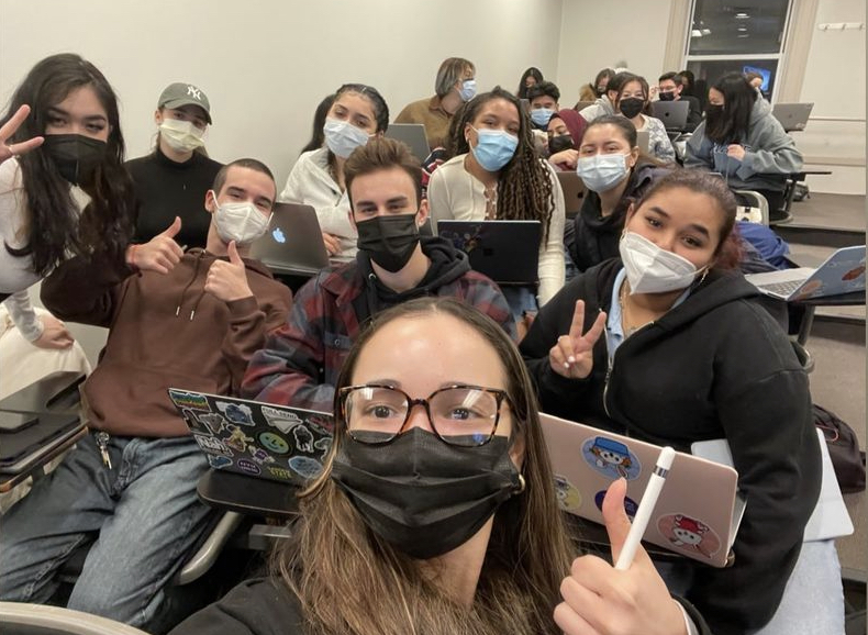 Students in class together. All are wearing masks
