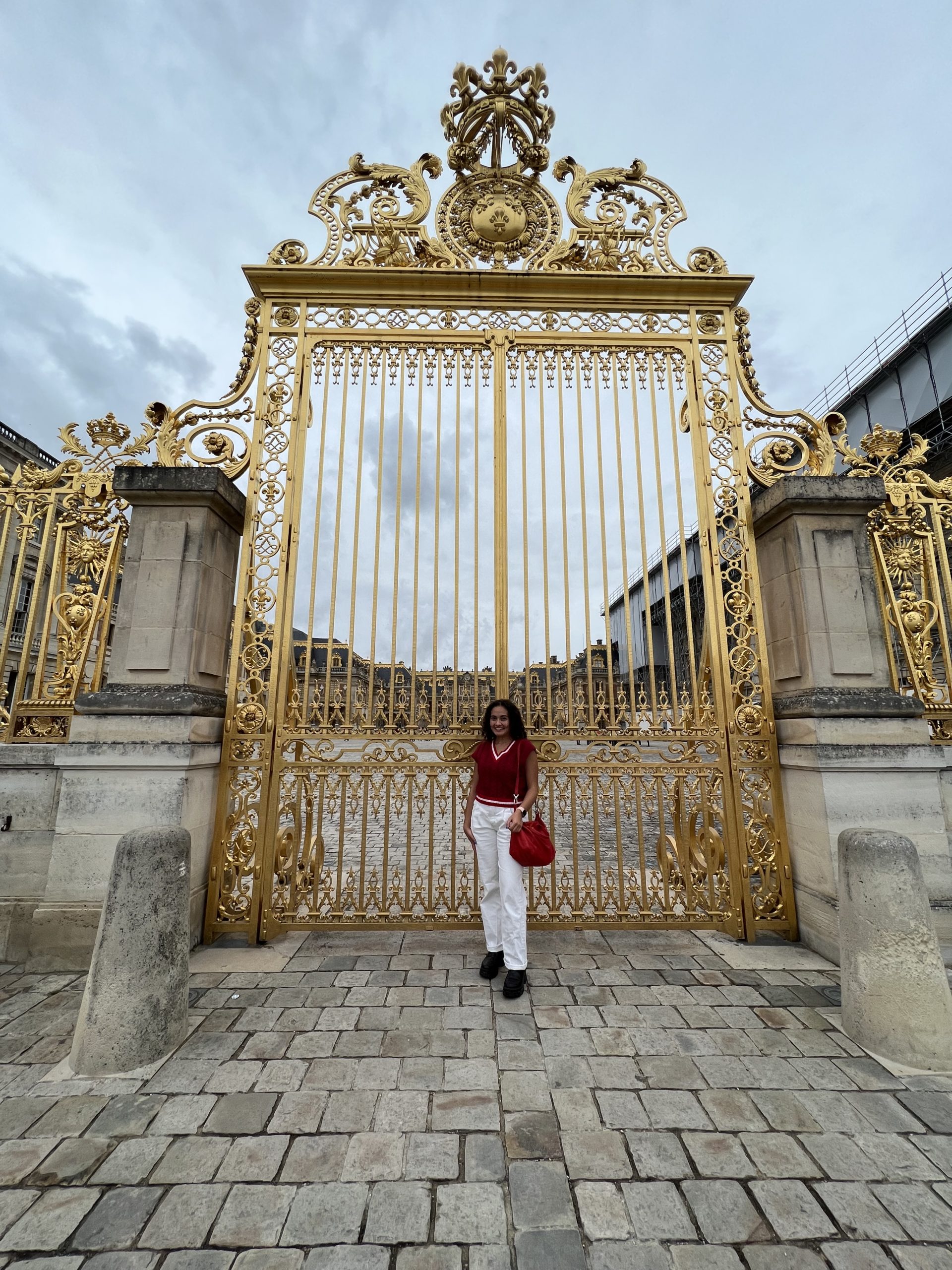 Girl in front of Versailles Gates