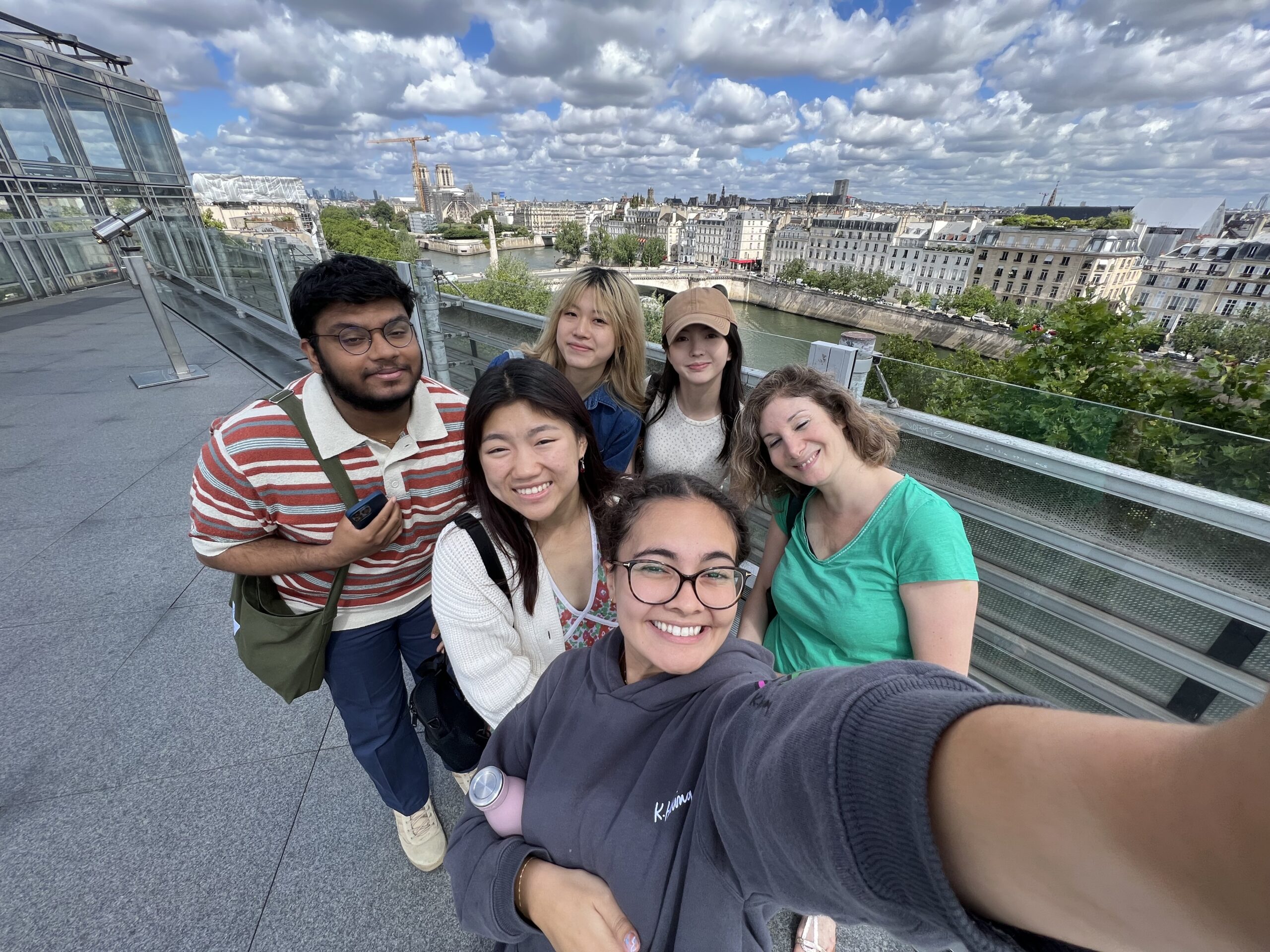 Group photo of students overseeing Paris skyline