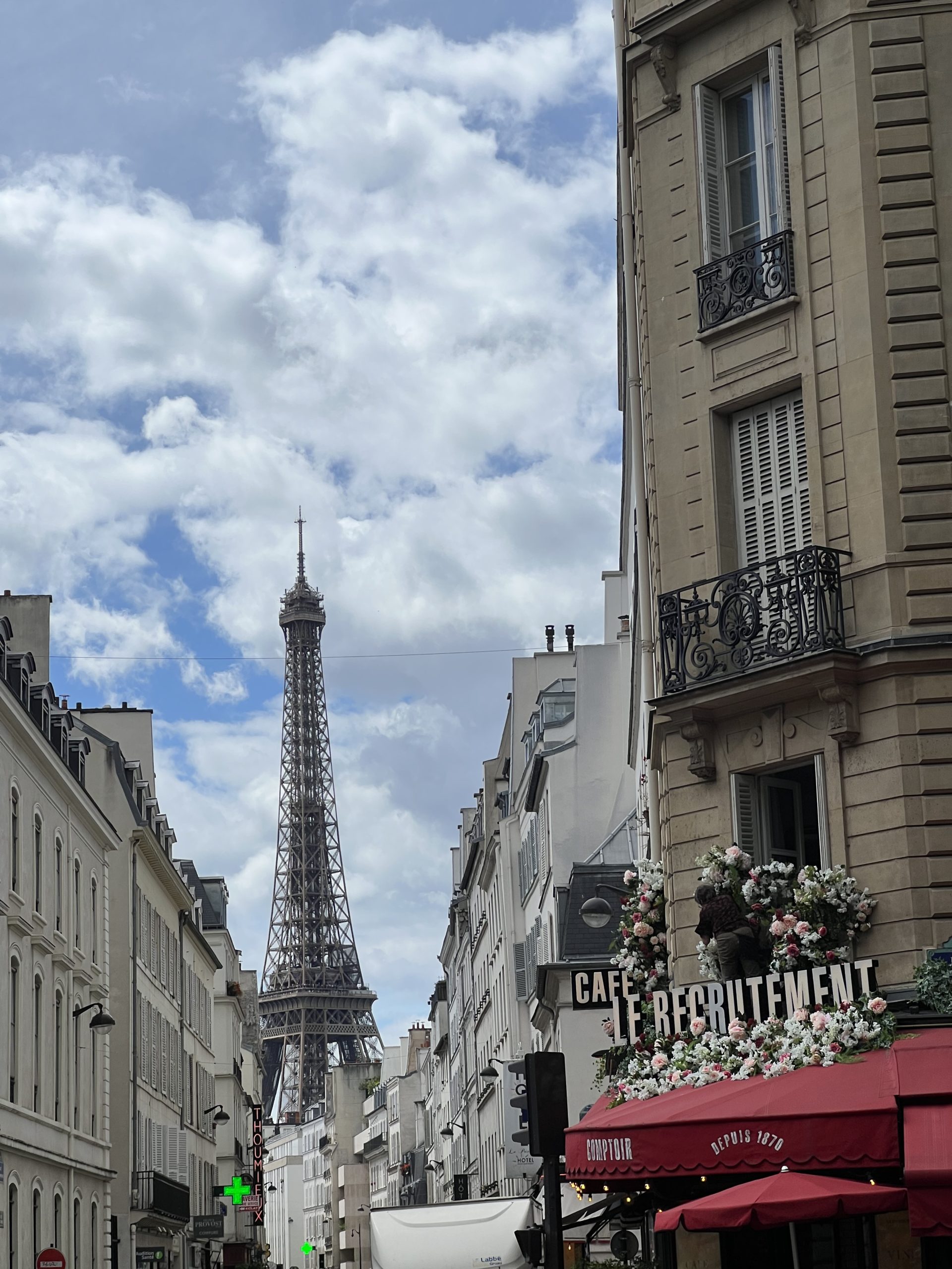 A view of the Eiffel Tower from a Paris street.