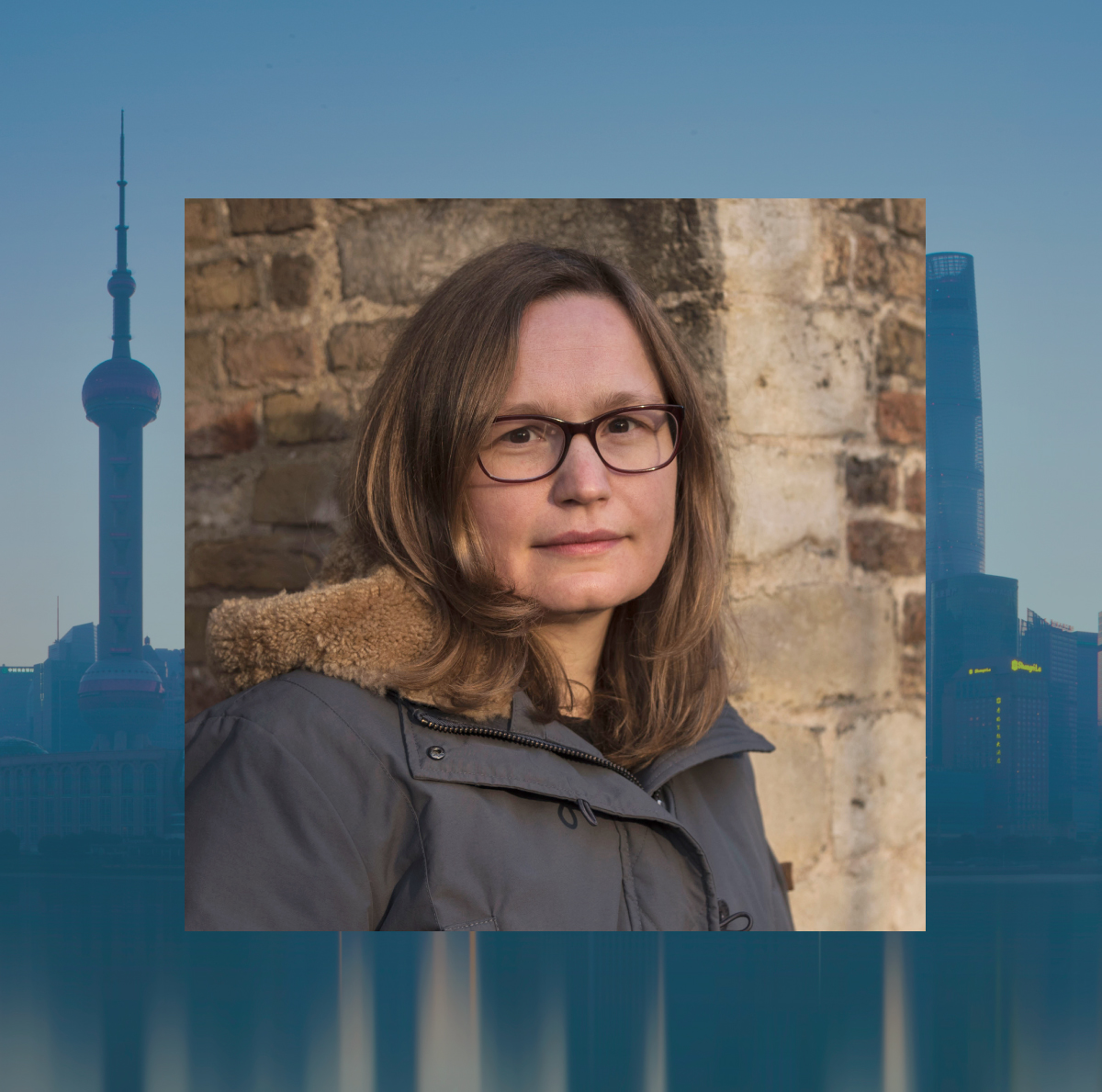 NYU Shanghai professor Lena Scheen with the Shanghai skyline behind her.