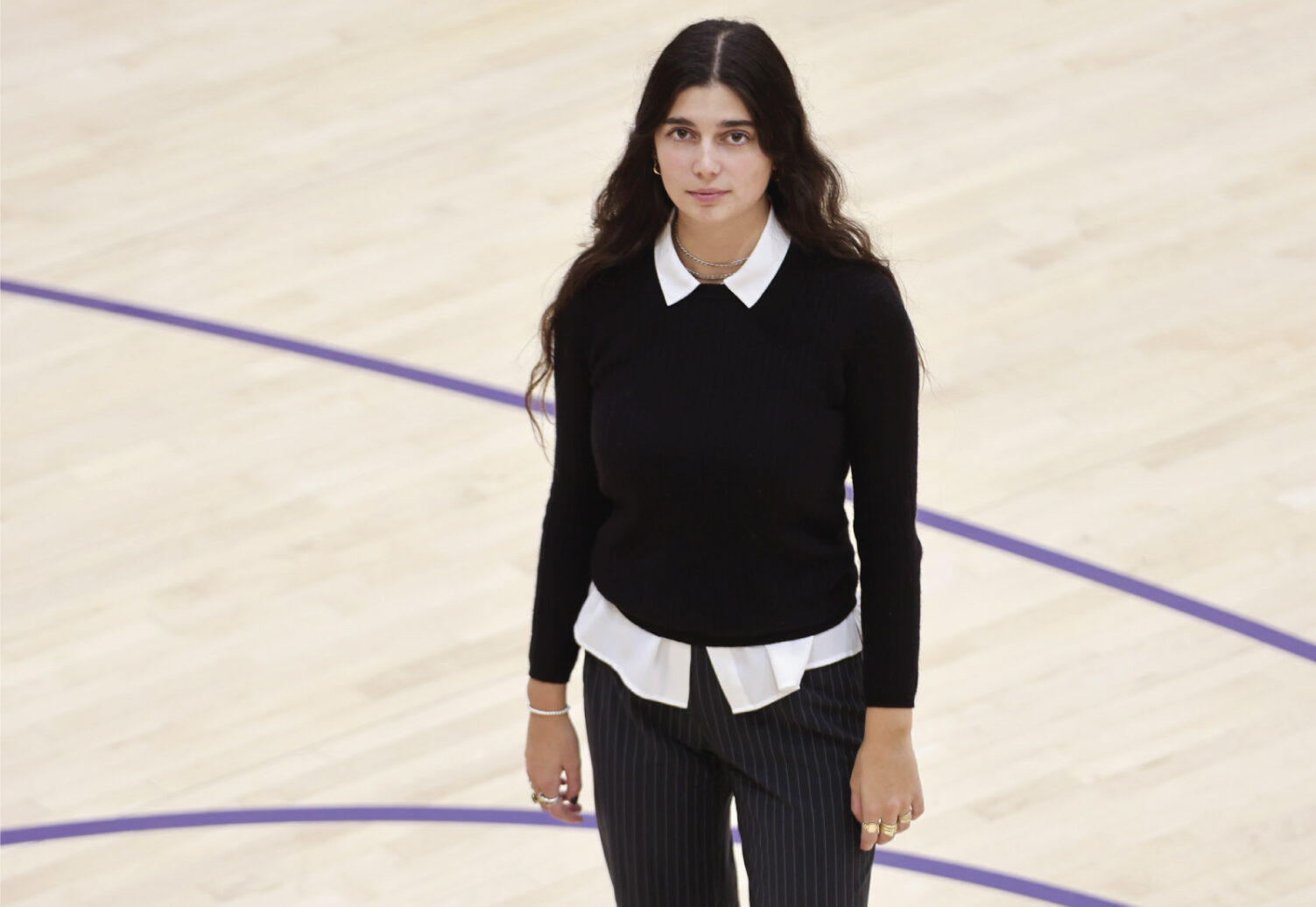 Bella Carino standing on a basketball court
