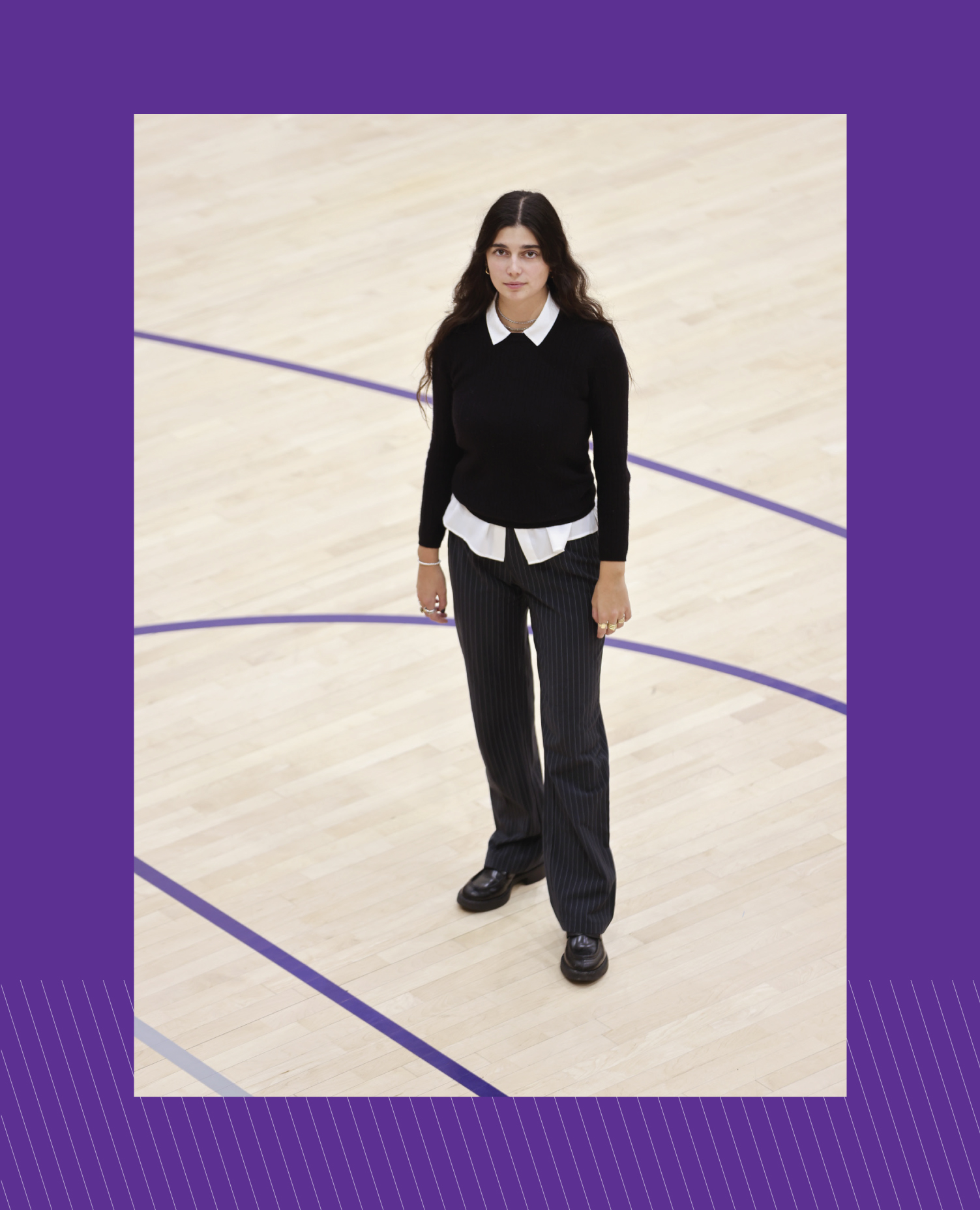 Bella Carino standing near the center of a basketball court.