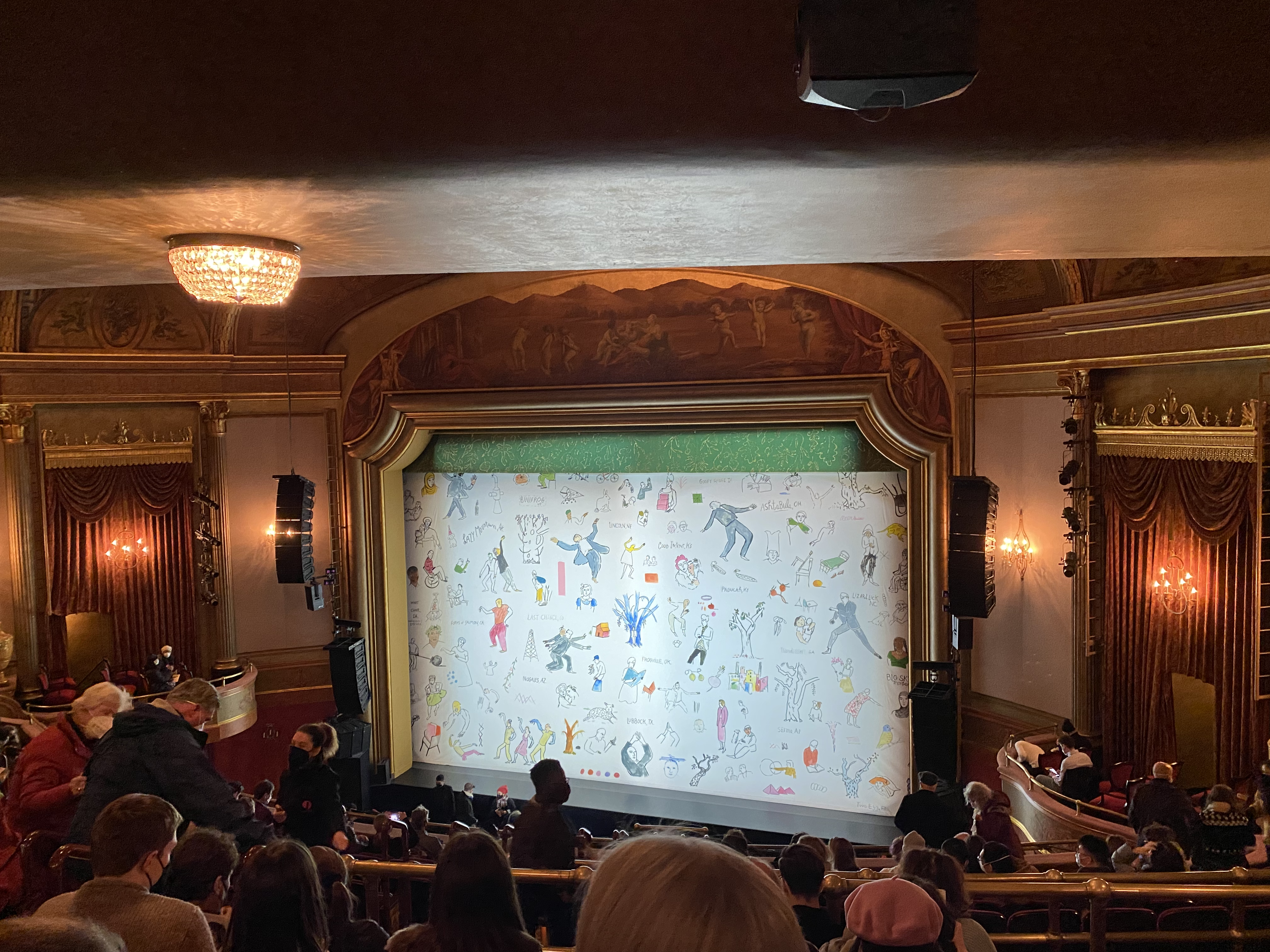 The stage curtain is down before a Broadway performance of American Utopia.