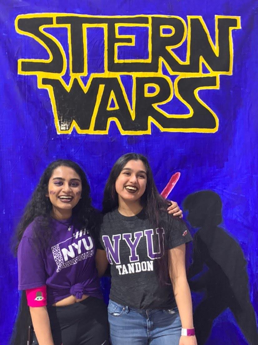 Eshika and a friend in front of a poster that says Stern Wars.