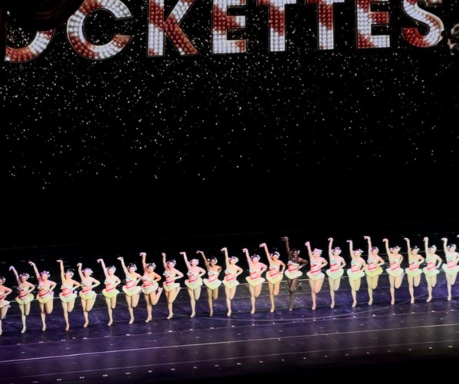 Rockettes stand in their iconic kickline at Radio City during their Christmas Spectacular