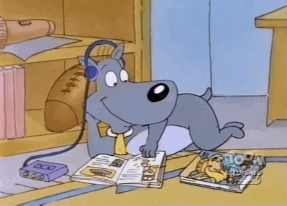 Gif of a cartoon dog listening to headphones and reading a magazine