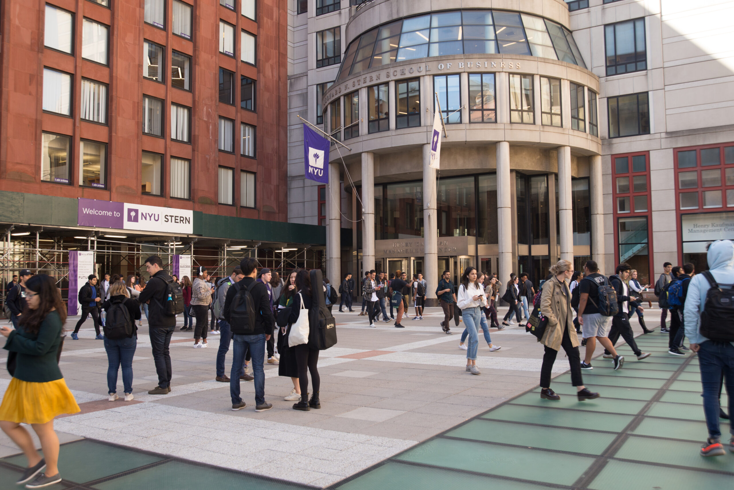 Students walking in the concourse outside the NYU's Stern School of Business building.