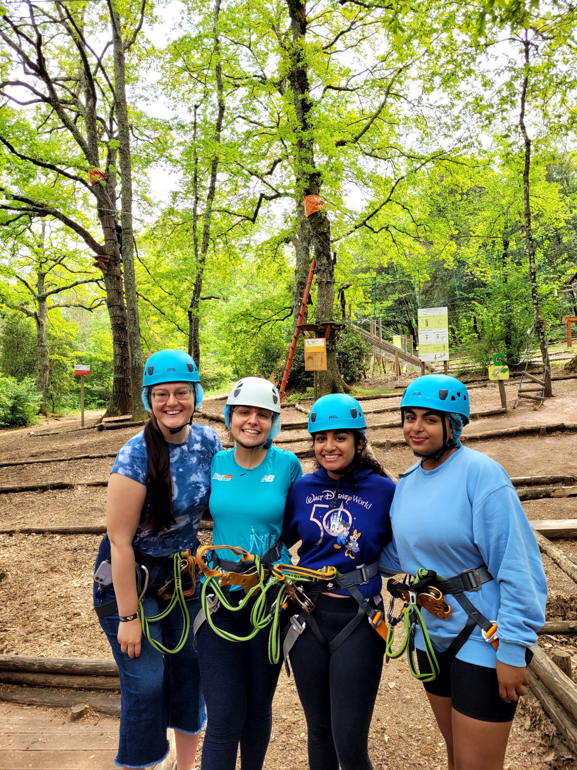 eshika and friends in helmets and harnesses for obstacle course fun in Florence