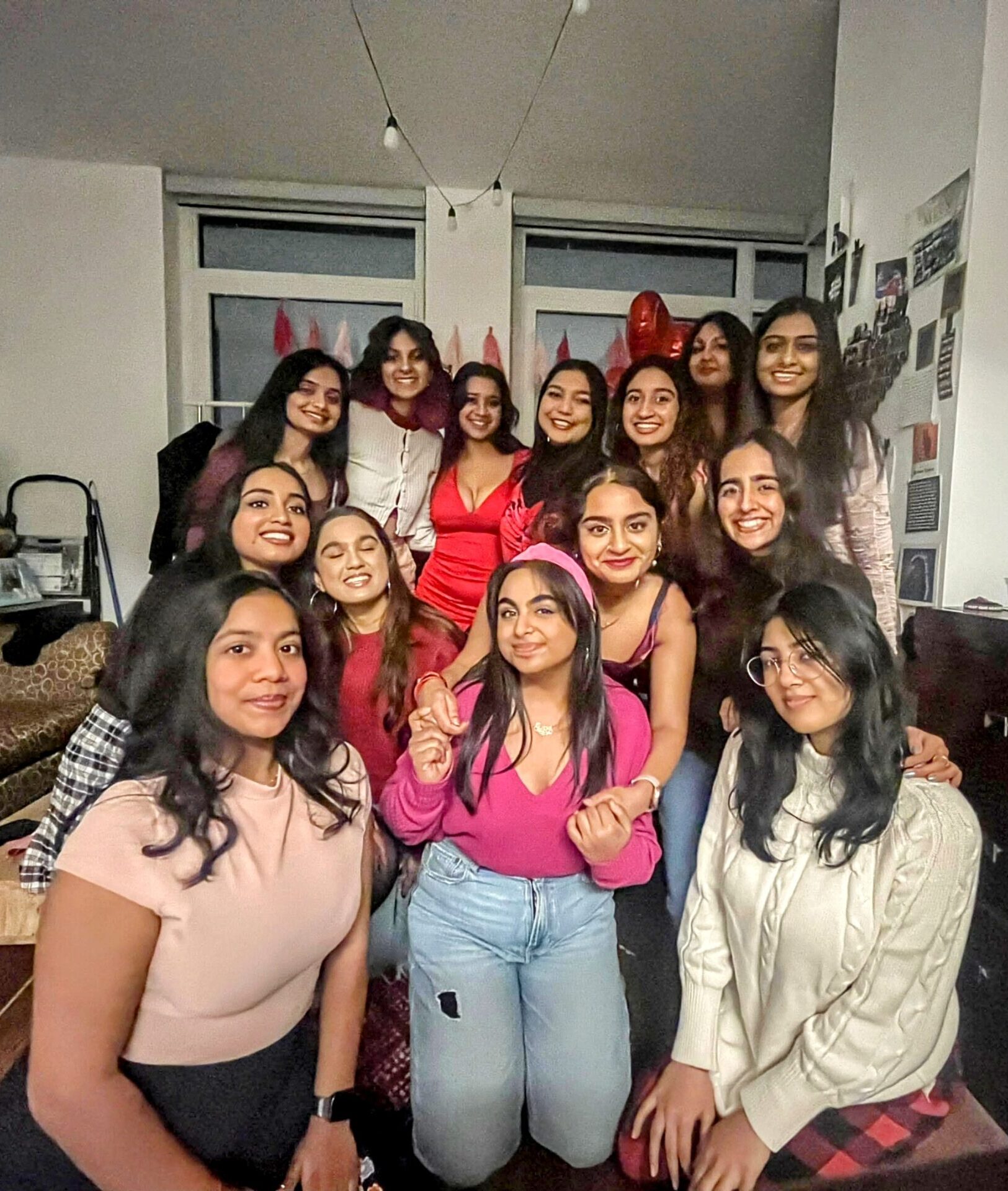 A bunch of girls gathered for a group photo