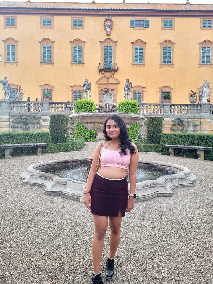 Eshika stands in front of the NYU Florence building