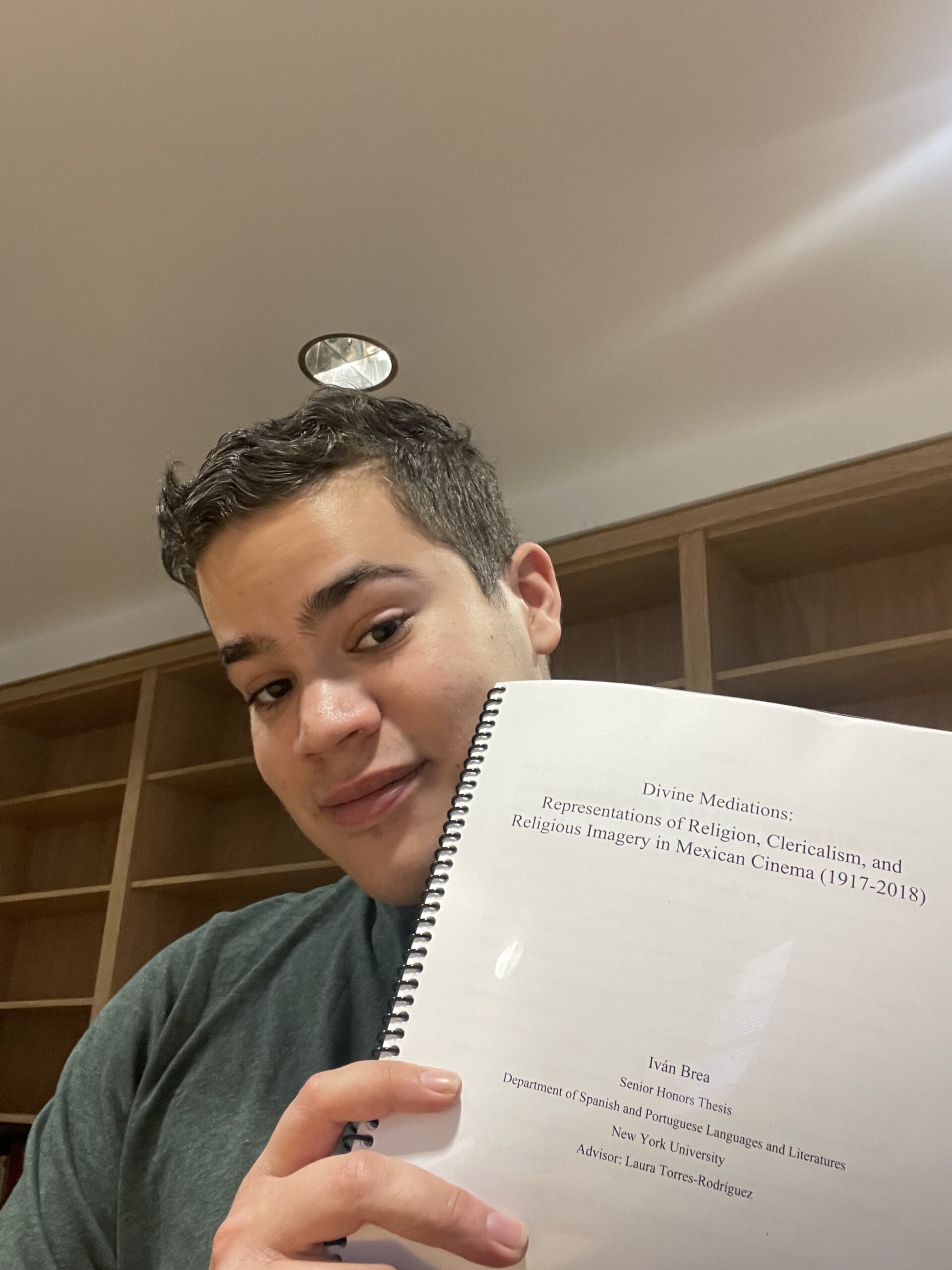 Ivan displaying his senior honors thesis.