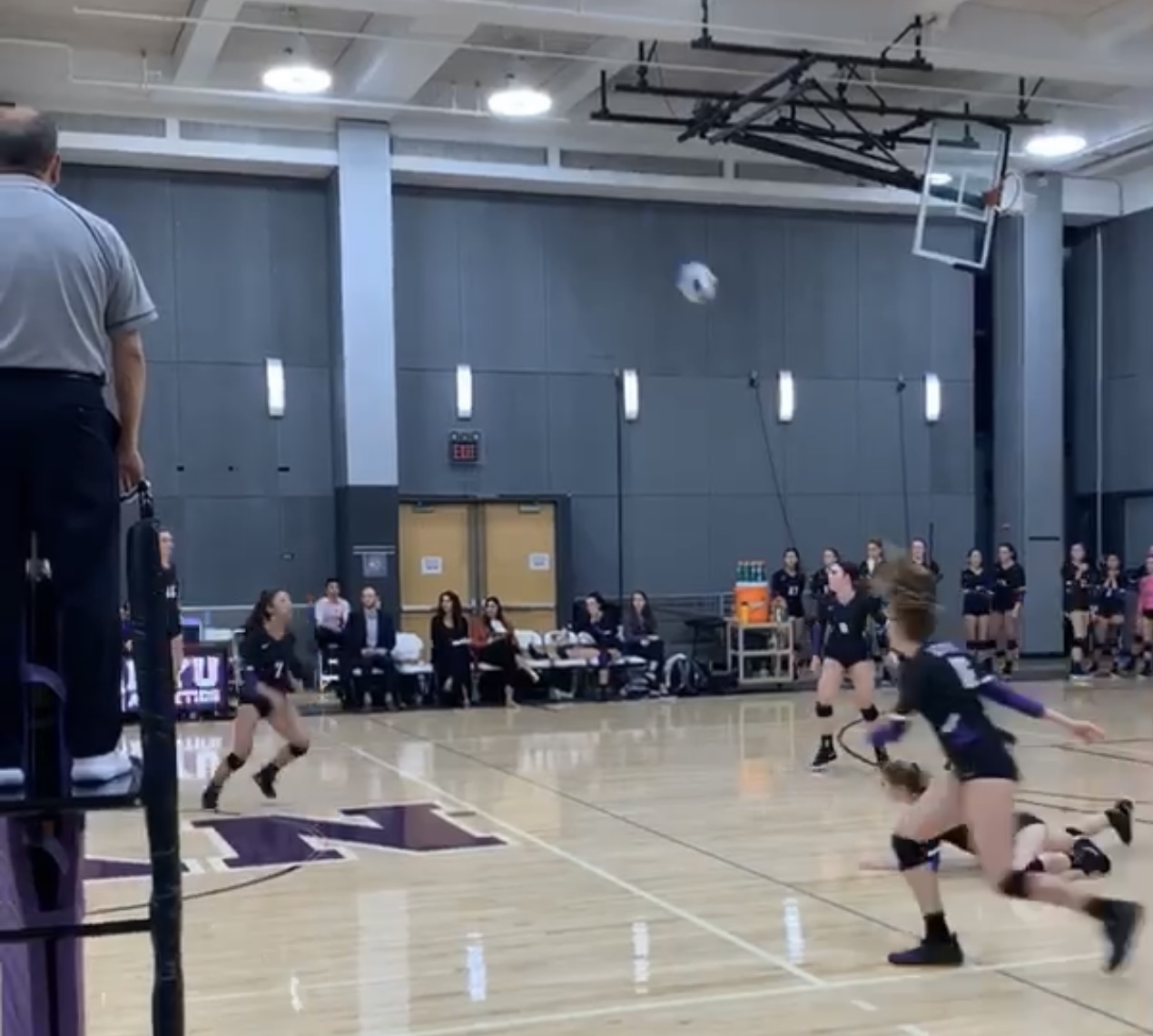A player on the NYU Women’s Vollyball recently pancaked the ball, stopping it from hitting the ground and keeping it in play.