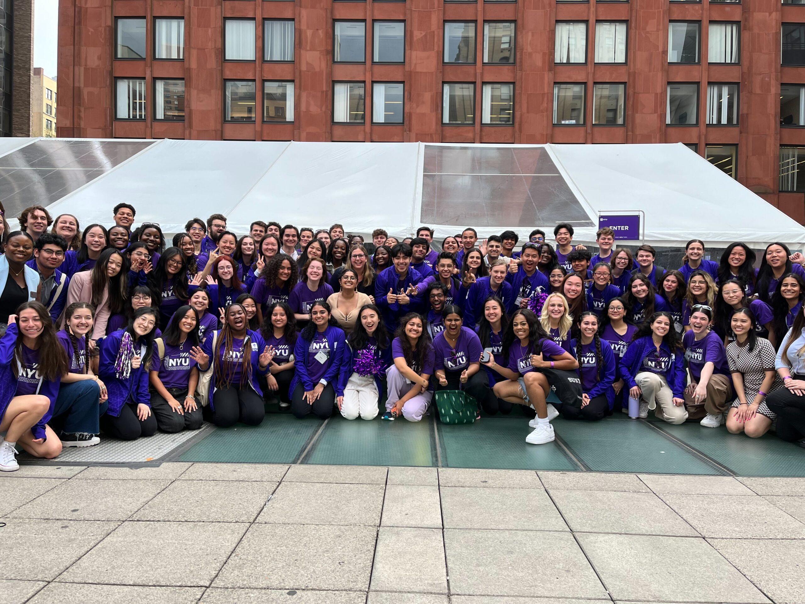 Many NYU Ambassadors gathered in Gould Plaza for a group photo