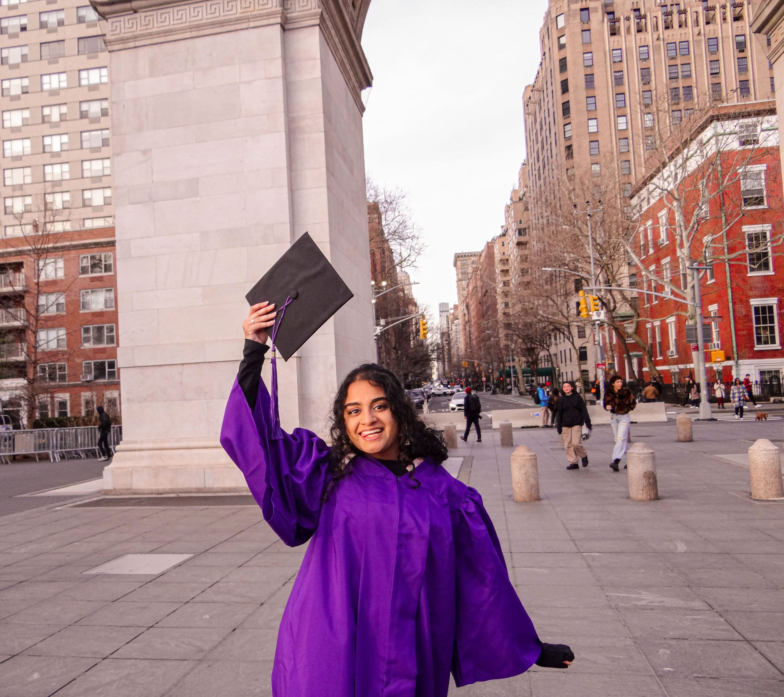 Eshika with her grad cap in front of the WSP arch