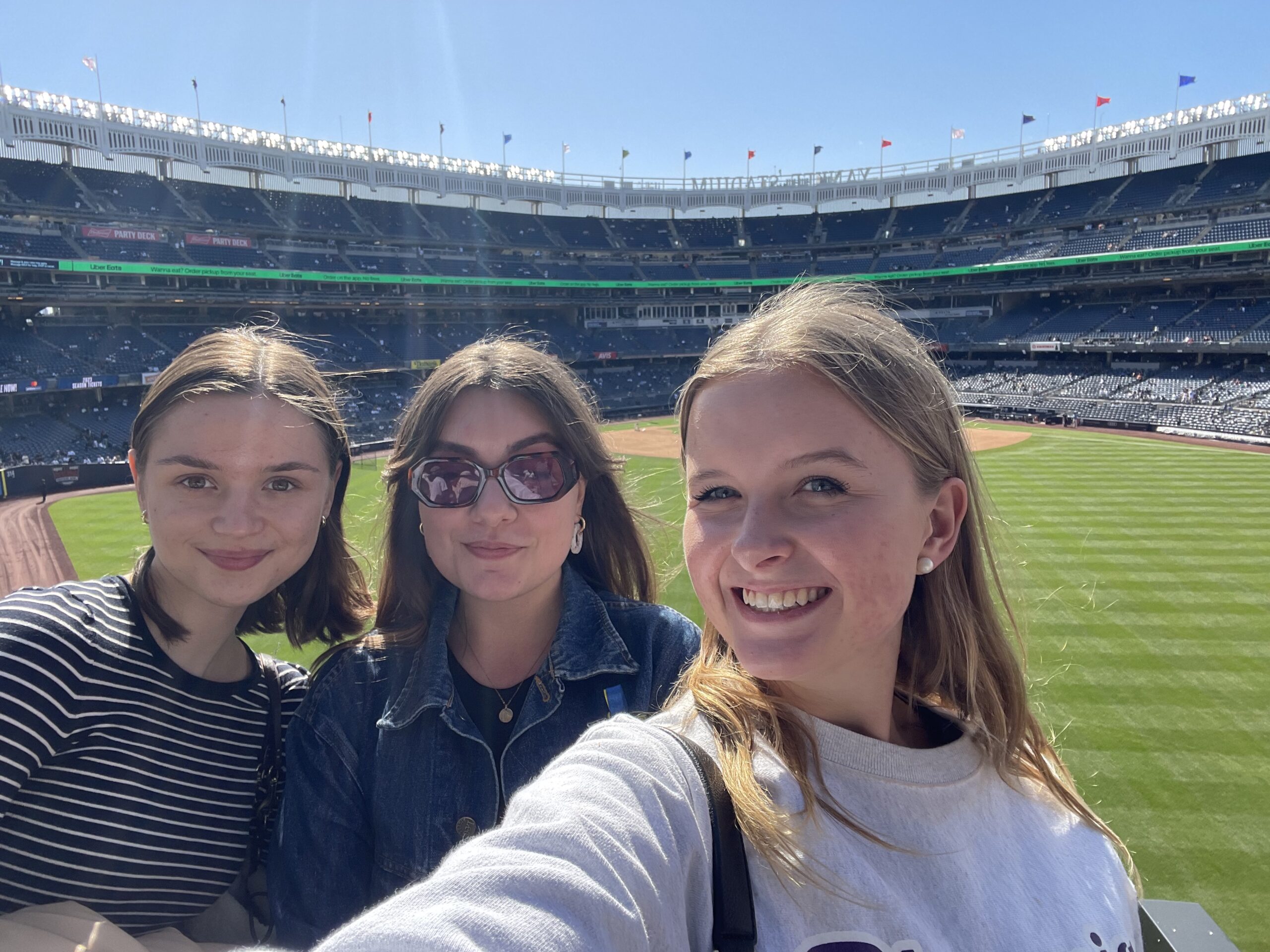 Amina and two friends pose for a selfie at Yankee Stadium