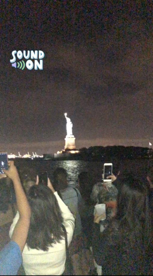 A Instagram story of students singing “Empire State of Mind” to the Statue of Liberty on the FYRE Moonlight Cruise, an NYU tradition.