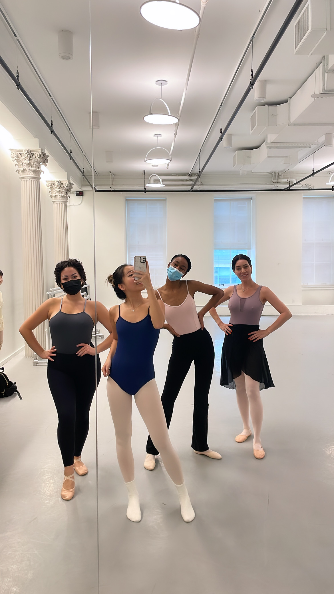 4 students pose for a selfie in a Ballet class