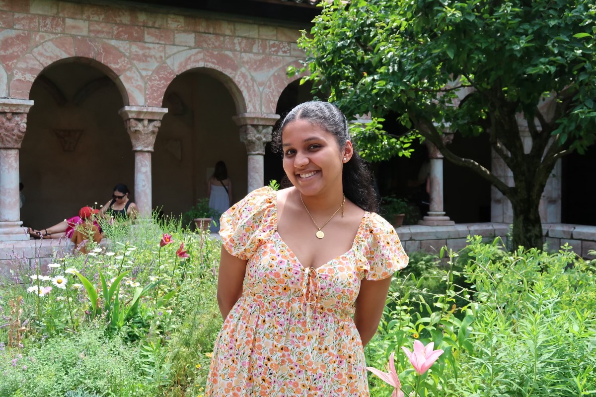 Photo of Anjana Rajesh in a garden, smiling