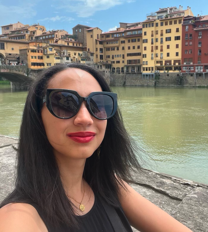 Kerri stands in front of Ponte Vecchio in Florence Italy