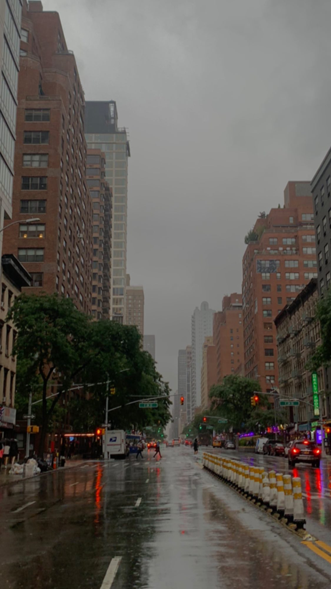 A rain-soaked New York City street.
