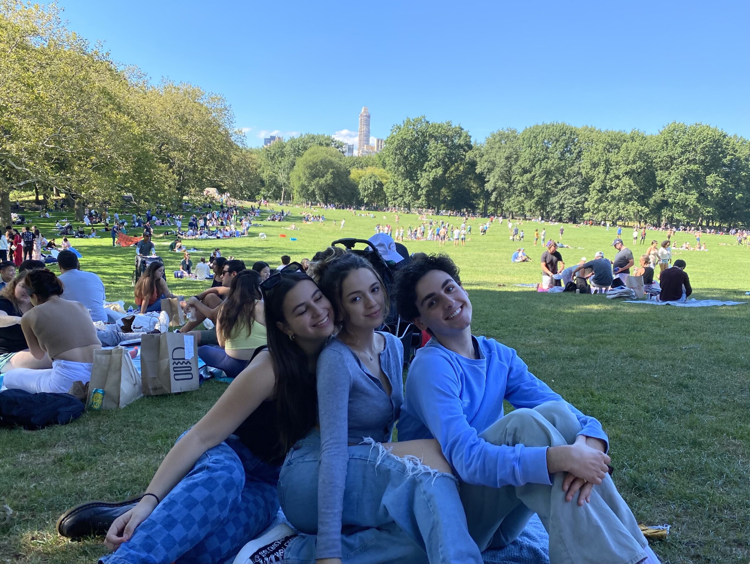 Me and some of my friends sitting with each other at a Central Park picnic
