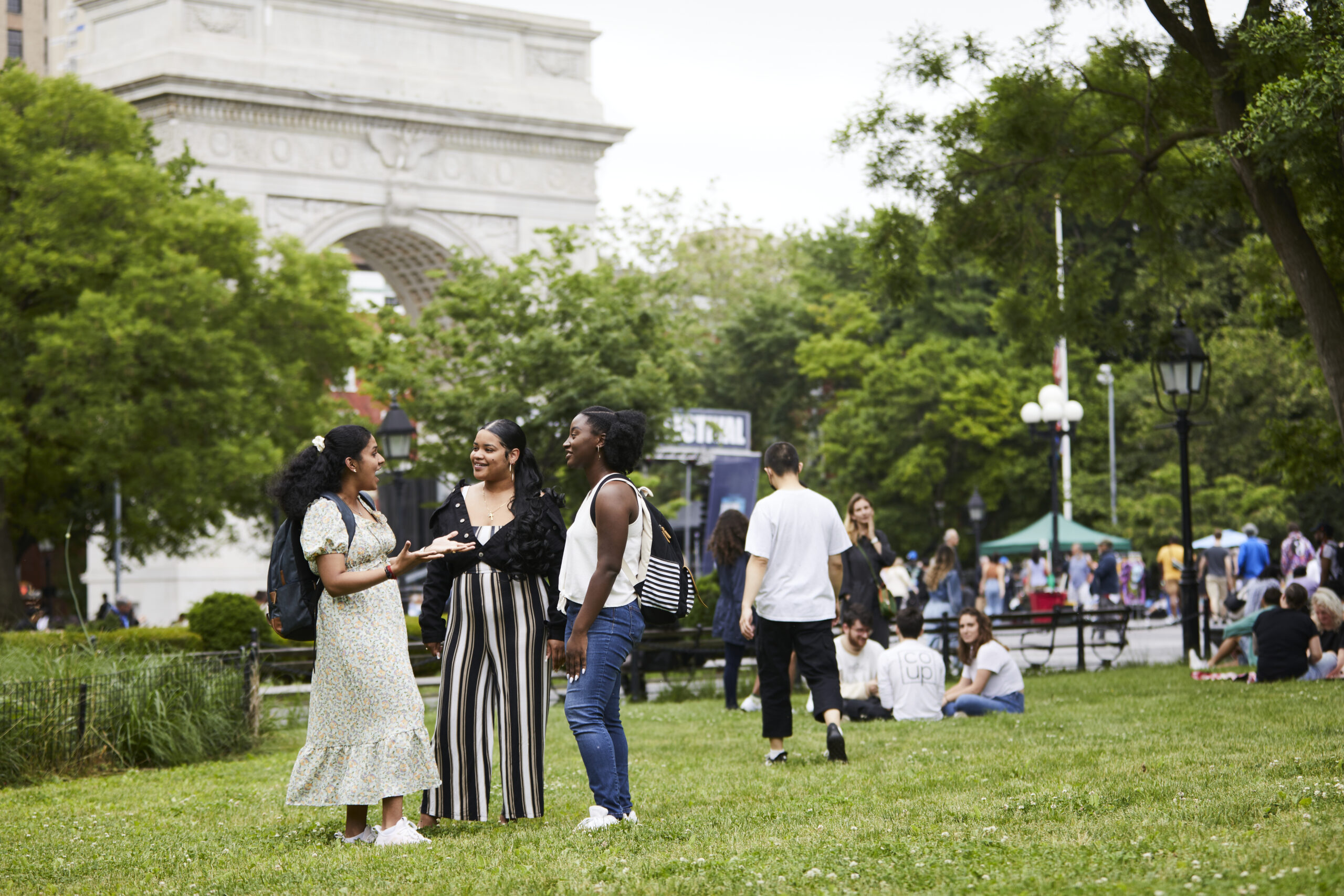 A group of students spending time on the lawns in Washington Square Park in New York City.