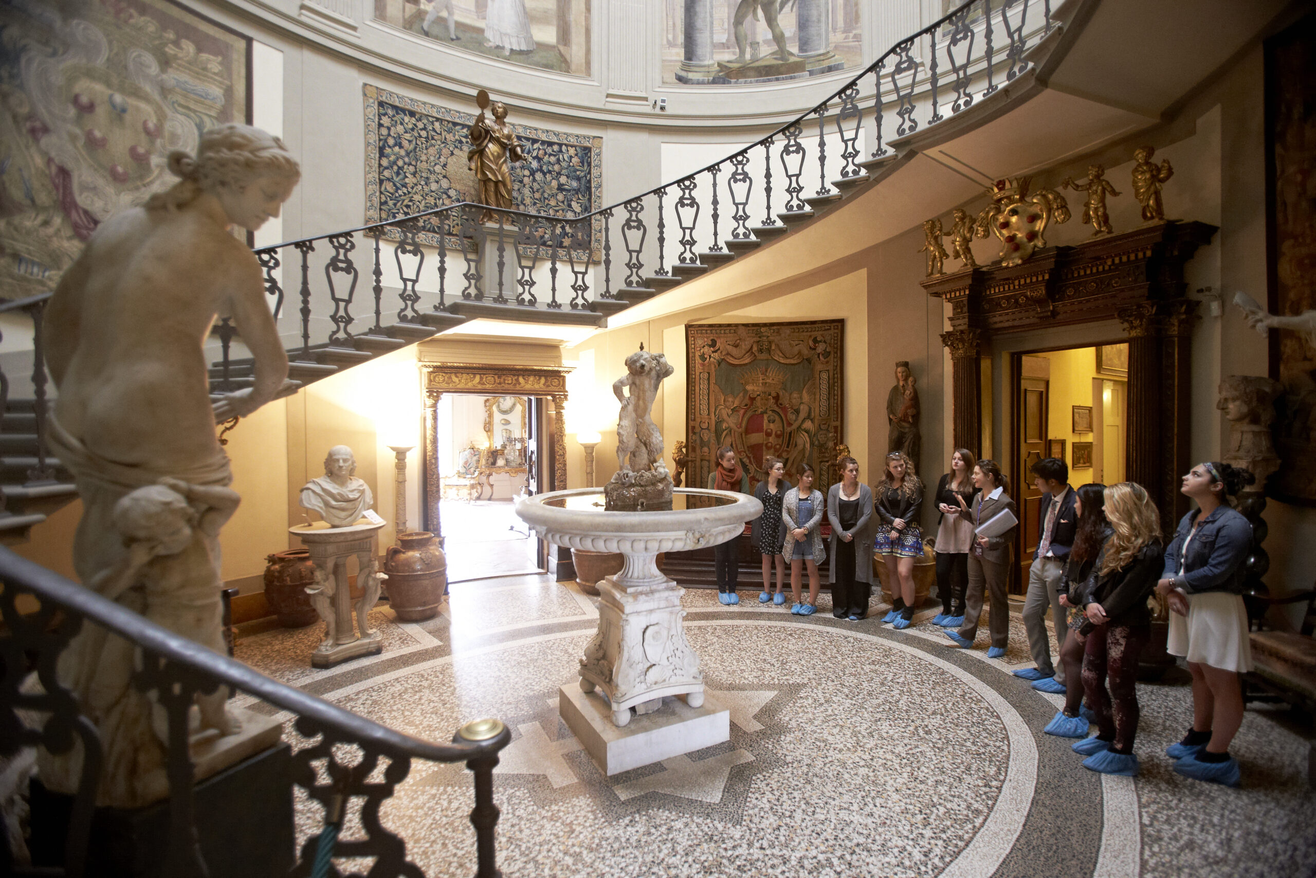 NYU Florence students gathered in Villa La Pietra during a History of Italian Fashion class session with Professor Patricia Lennox.