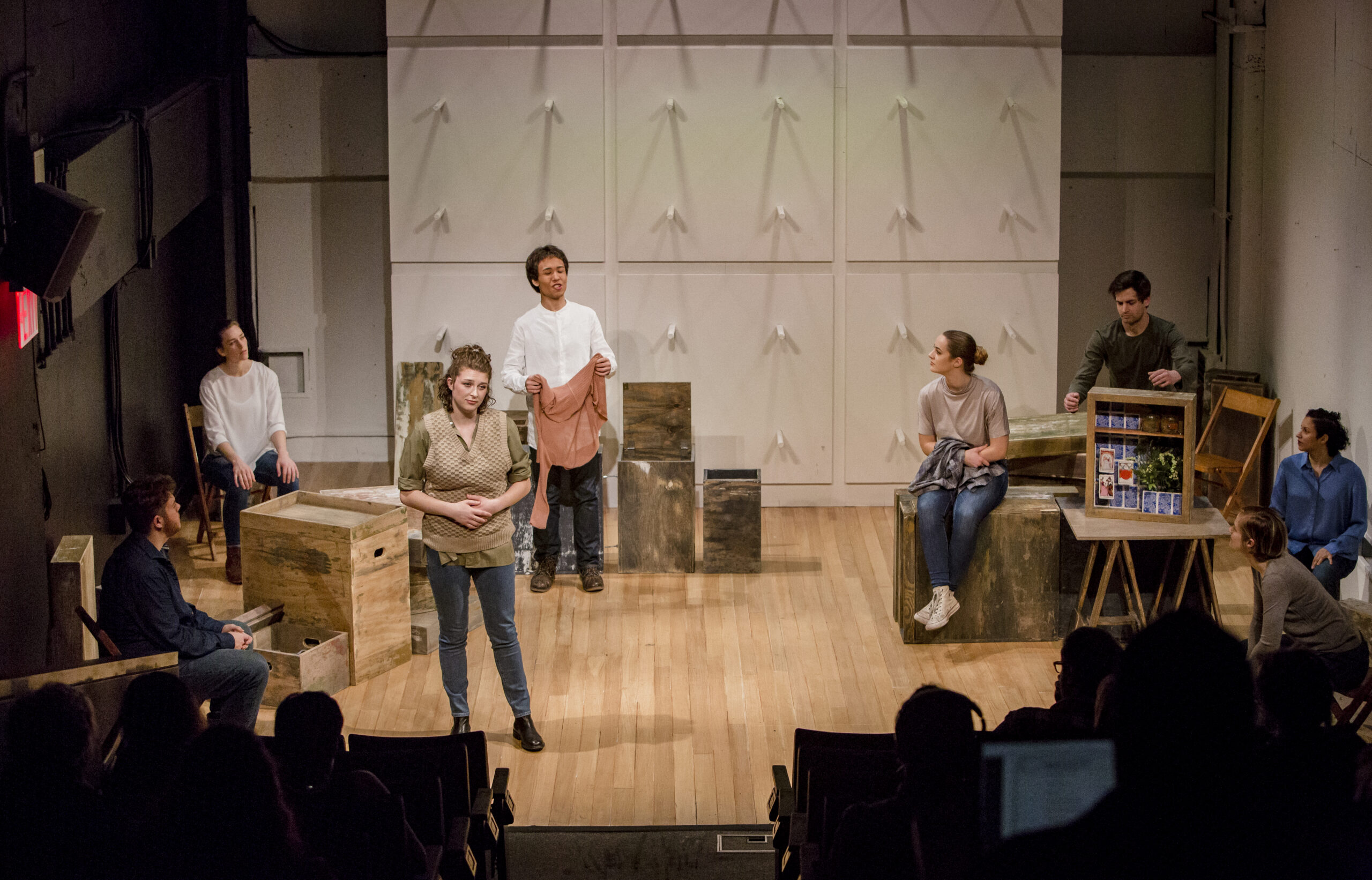 Students onstage performing a play.