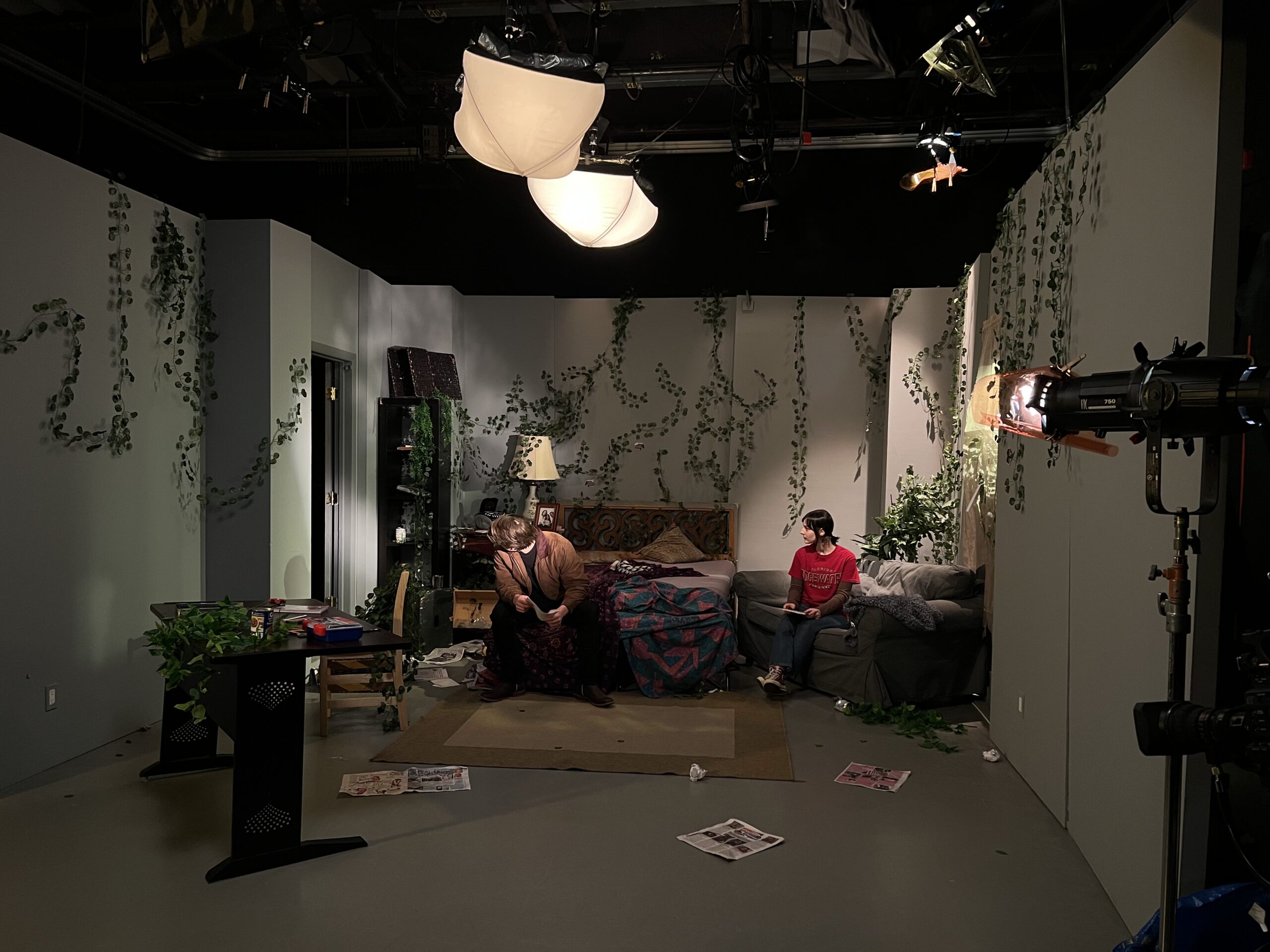 Two students sitting on a couch during a sound recording exercise