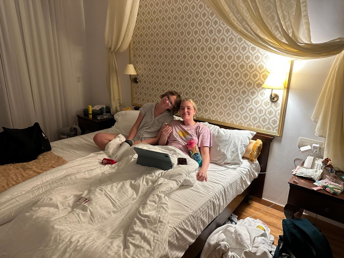 The author and her friend Aurora enjoying a movie in their hotel in Crete, Greece.