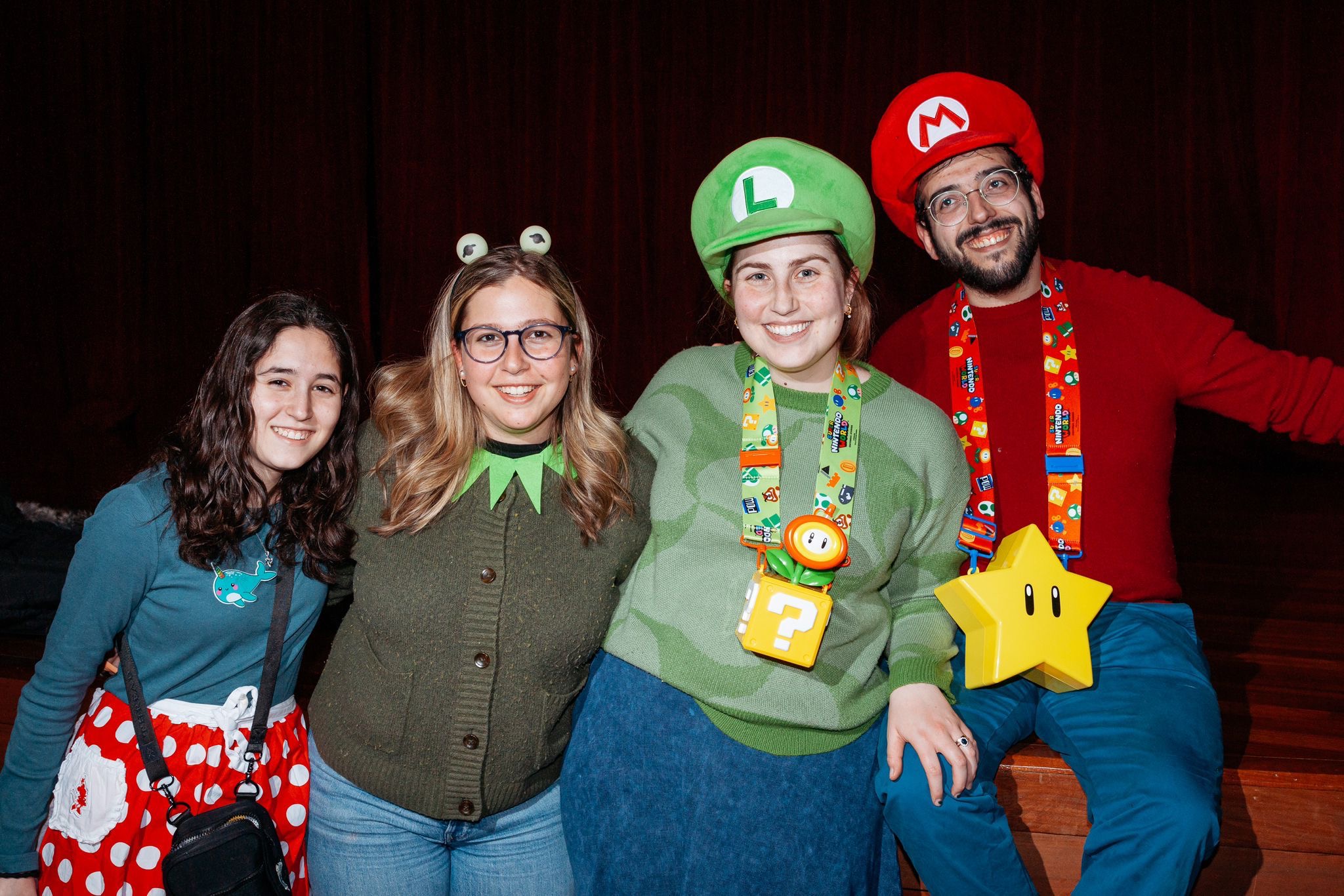 Four Jewish students wearing costumes for Purim.
