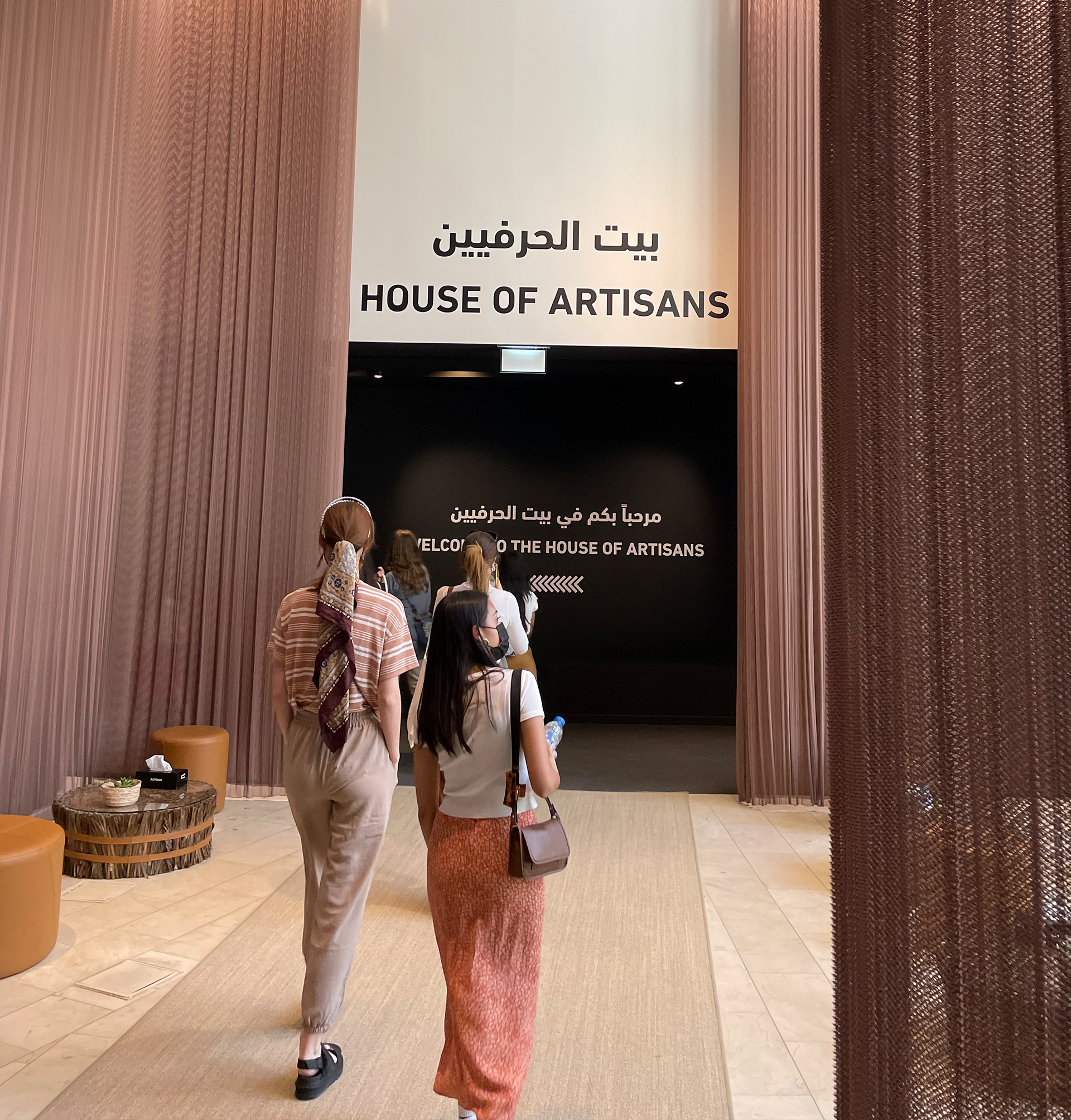 Students walking into an exhibit at the Louvre in Abu Dhabi.