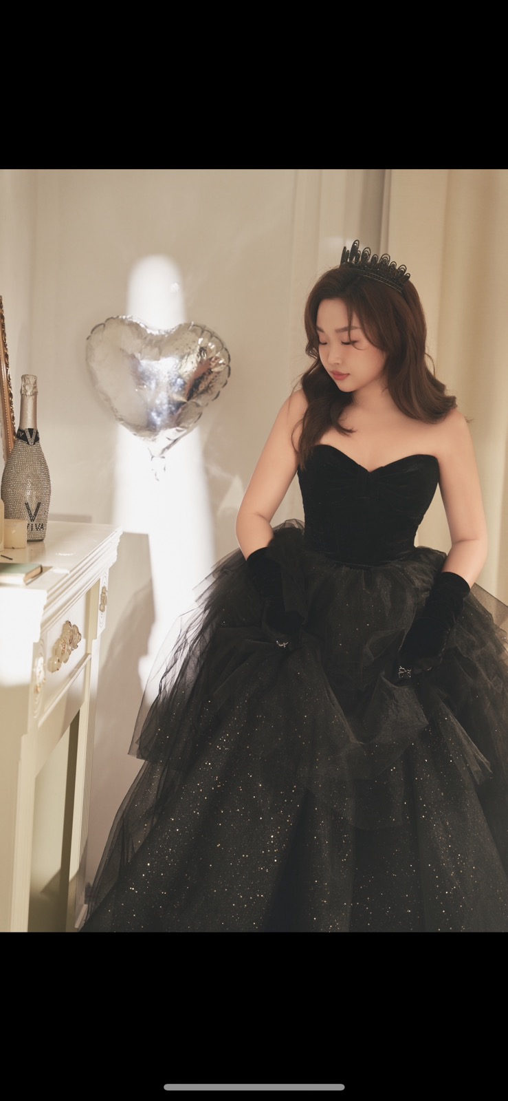 Lily Blair in a black dress