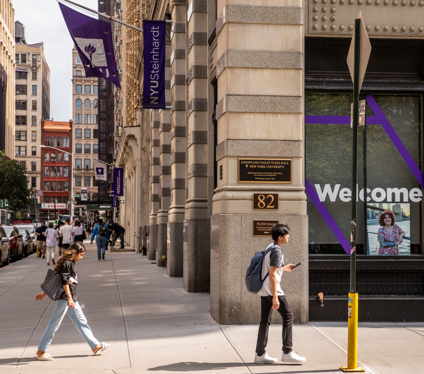 NYU students passing through campus in New York City.