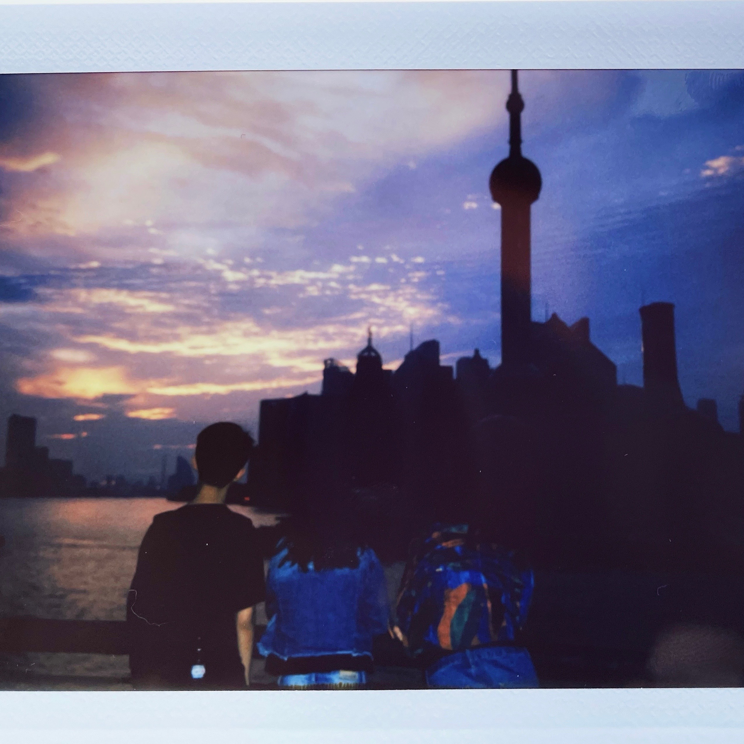Me watching sunrise at the Bund in front of Oriental Pearl Tower