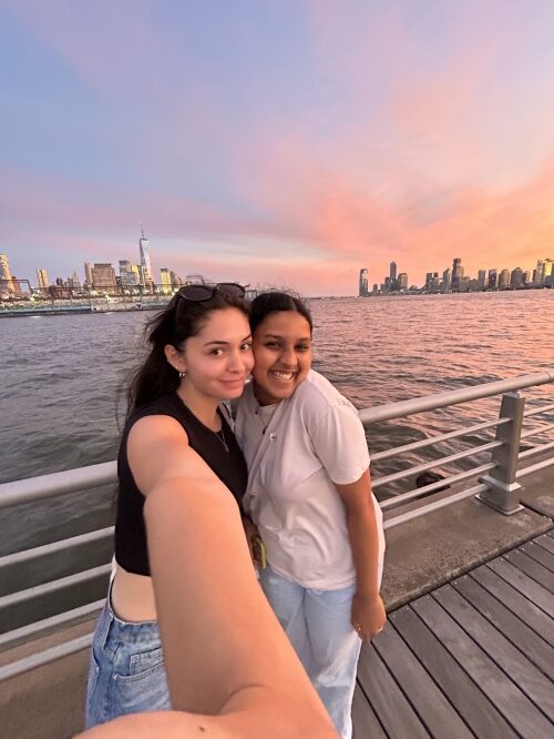 A selfie of two girls on a pier