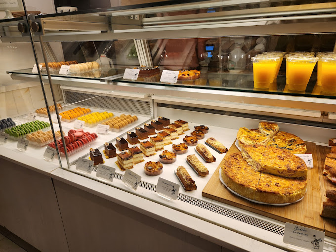 Pastries lined up in a display case.