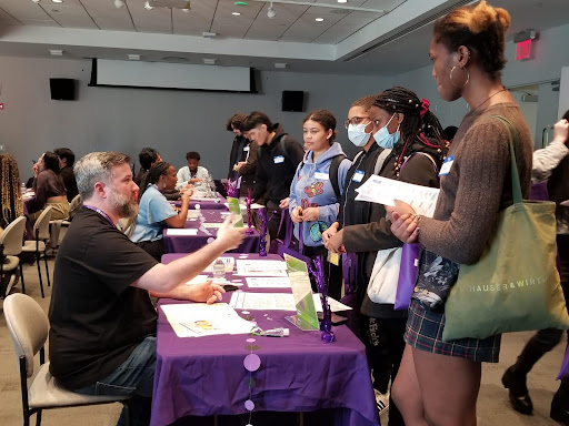 Stephen W. at the Tax table informing students about taxes.