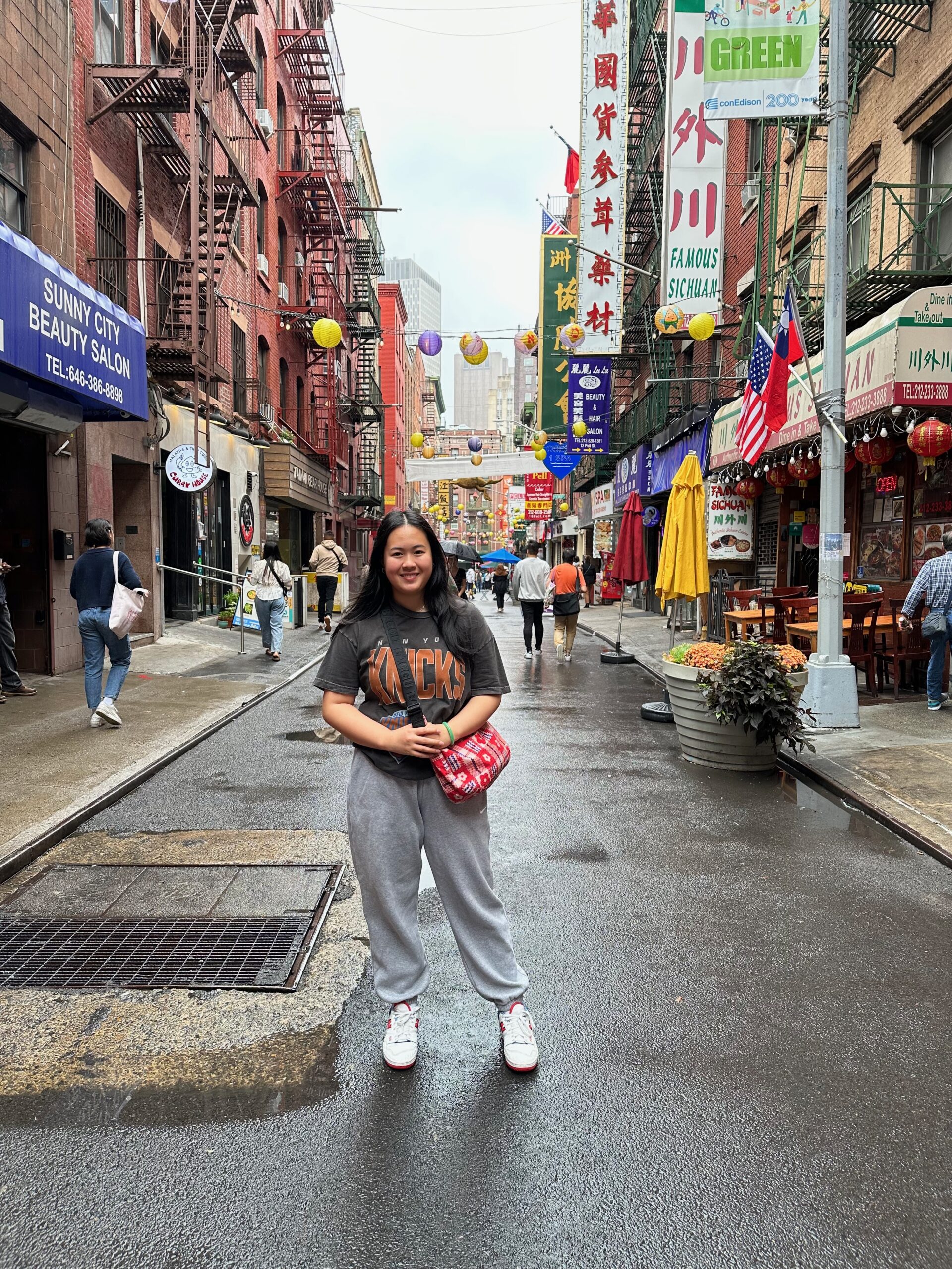 The author standing in the middle of a street in Chinatown during a grocery store run.