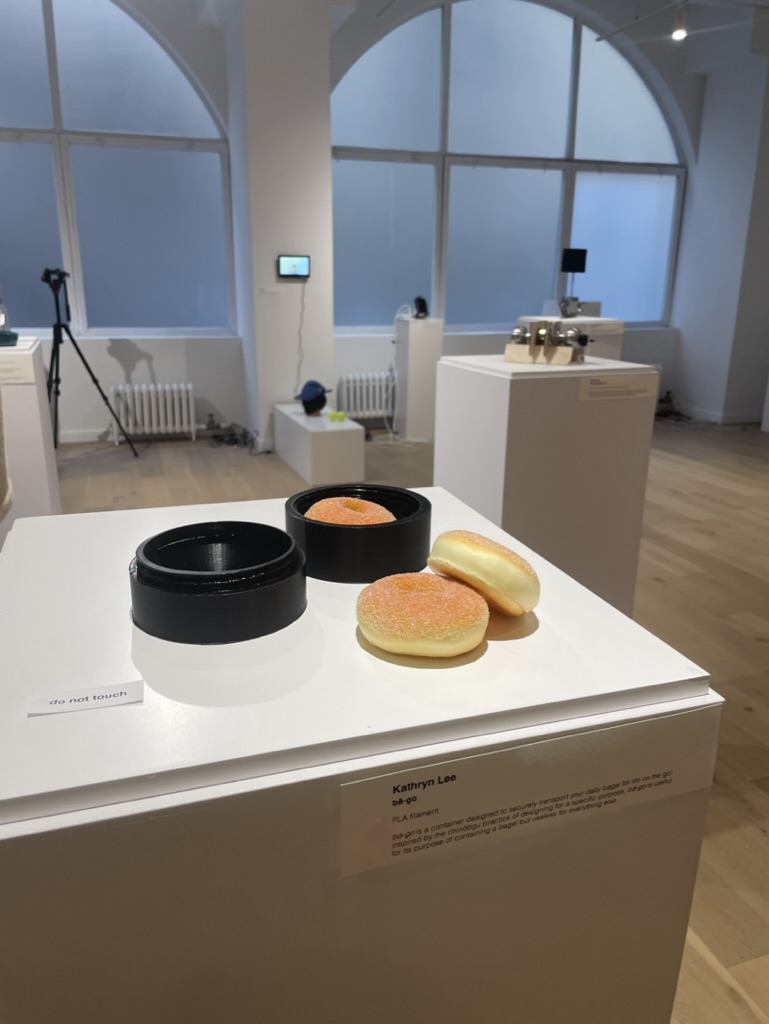 “Bā-go,” the author’s finished “useless” bagel container displayed in a gallery.