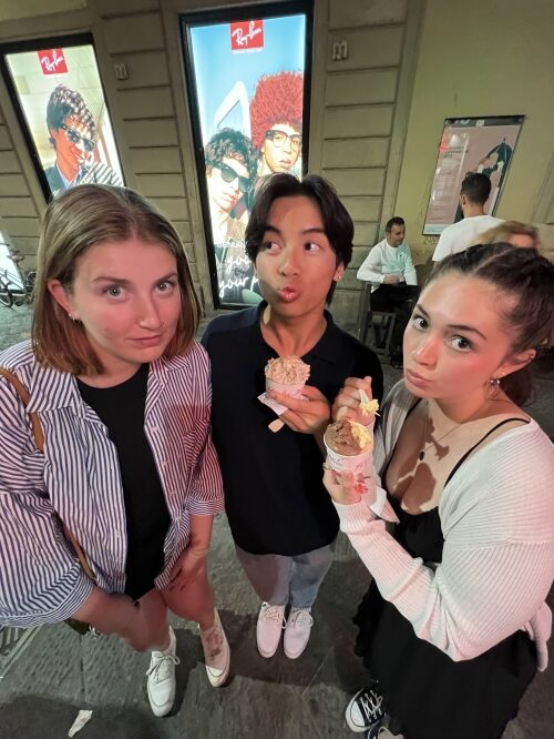 three students holding ice cream